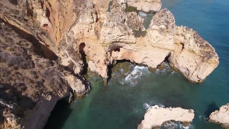 Aerial-view-of-Ponta-da-Piedade-rock-formations-in-Lagos,-Portugal