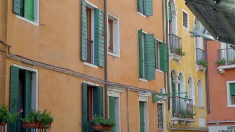 The-green-windows-of-the-pink-building-apartment