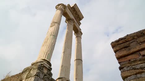 The-red-brick-wall-beside-the-temple-of-Castor-and-Pollux-in-Rome-in-Italy