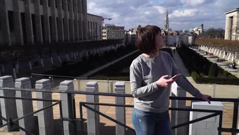 tourist-lady-looks-at-attractions-in-the-city-of-Brussels-Belgium