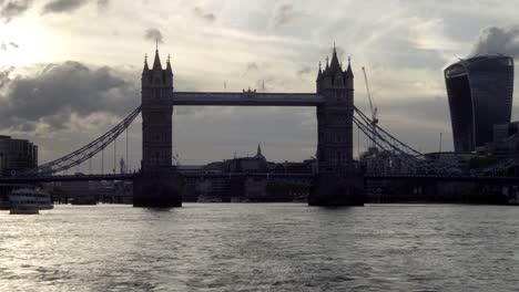 Tower-Bridge-silhouette-on-Thames-River-from-boat-view-in-London