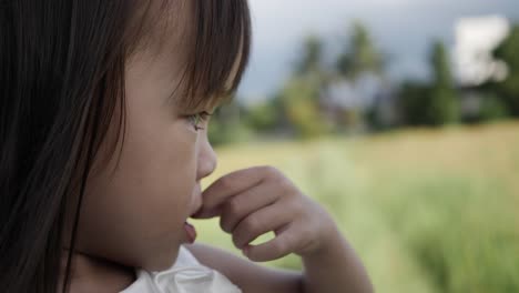 Slow-motion,-Close-up-adorable-little-girl-smiling-and-shy