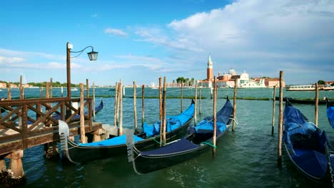 Gondolas-in-lagoon-of-Venice,-Italy