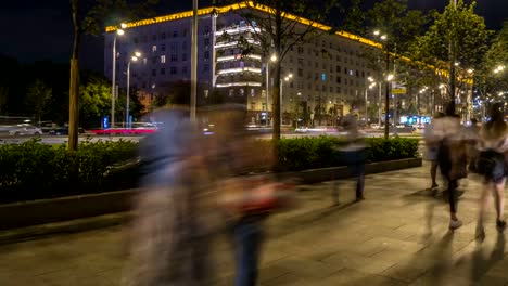 the-flow-of-pedestrians-and-cars-following-the-city-street,-time-lapse