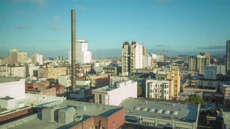 Sun-going-down-over-city-rooftops-4k