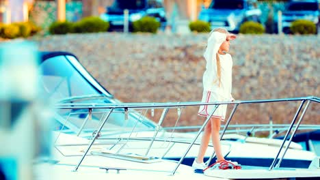 Beautiful-girl-on-a-yacht-looking-into-the-distance