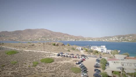 Aerial-view-of-a-young-man-flying-his-drone-at-the-seaside-in-Greece.