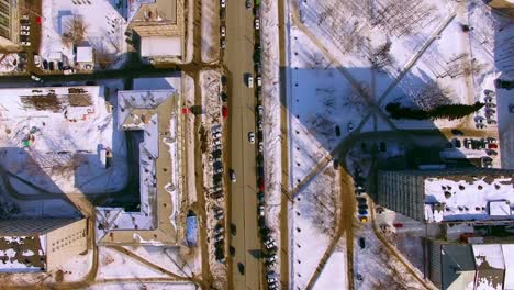 The-copter-flies-over-winter-street-in-the-city-of-Novosibirsk.-View-down.-4K