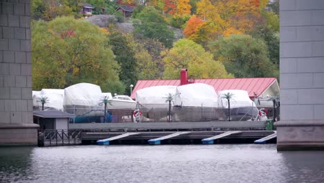 Speedboats-covered-in-clothes-on-the-yard-in-Stockholm-Sweden