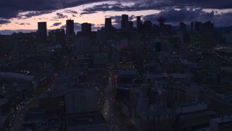 Aerial-View-flying-over-downtown-Vancouver-at-sunset