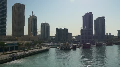 sunny-day-dubai-marina-yacht-dock-canal-side-bay-panorama-4k-united-arab-emirates