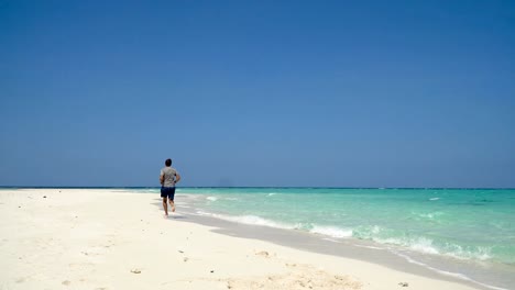 Man-running-on-the-beach