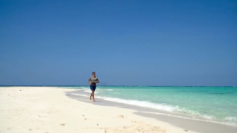 Man-running-on-the-beach