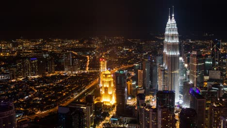 Time-Lapse---Nightscape-at-Kuala-Lumpur-City.-High-Angle/Aerial-View.-Petronas-Towers-Visible