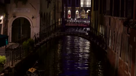 A-white-boat-with-passengers-crossing-the-grand-canal-in-Venice-Italy