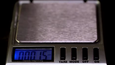 Close-up-of-electronic-scales-being-in-use.-Laboratory-scales.-Laboratory-worker-weighs-the-manufactured-tablets-on-the-control-scales.-Pills-and-medication-health,-close-up