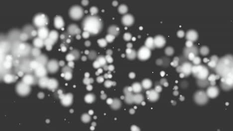 Fly-and-falling-white-round-particles-with-glitters-on-black-gradient-2