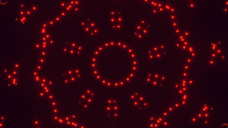 Repeat-neon-red-dots-in-vertigo-on-black-gradient