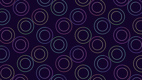 Neon-rainbow-rings-pattern-in-rows-on-black-gradient