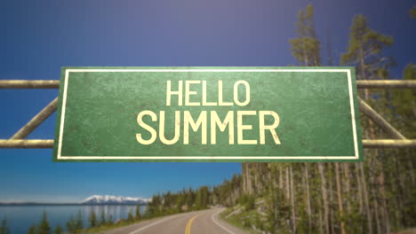 Hello-Summer-on-road-sign-with-road-and-forest-in-daytime