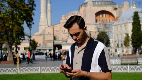 Young-man-phone-front-Hagia-Sophia