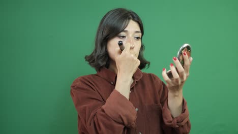 Frau-Make-up-Grüner-Hintergrund