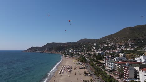 Paraglider-Descending-Towards-The-Beach