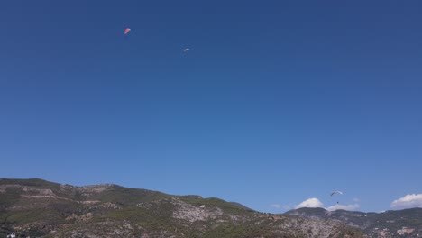 View-Of-Paragliding-Gliding-On-High-Mountain