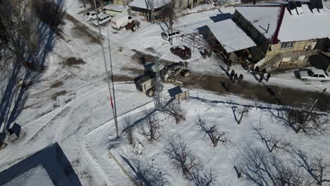 Grader-Plowing-Snow-in-the-Village