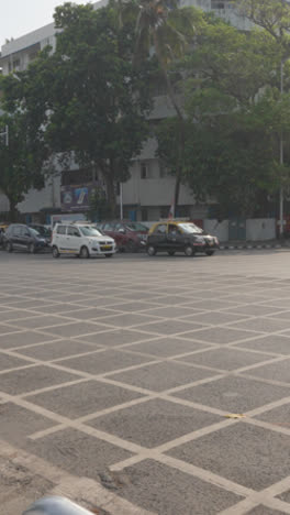 Vertical-Video-Of-Busy-Traffic-Junction-In-Mumbai-India-With-Cars-And-Buses-On-Marine-Drive