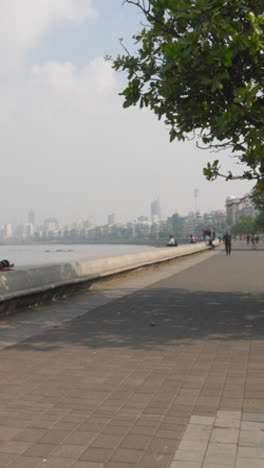 Vertical-Video-Of-Mumbai-City-Skyline-From-Marine-Drive-Walk-In-India-1