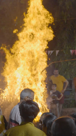 Vertical-Video-Of-People-Celebrating-Hindu-Festival-Of-Holi-With-Bonfire-In-Mumbai-India-2