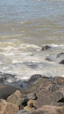 Vertical-Video-Close-Up-Of-Waves-Breaking-On-Bandra-Fort-In-Mumbai-India