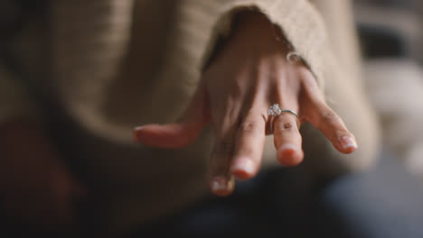 Close-Up-Of-Man-Putting-Engagement-Ring-On-Woman's-Finger-As-He-Proposes-Marriage-2
