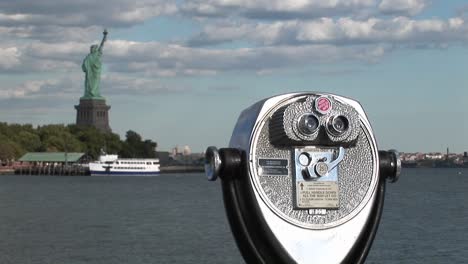 A-tourist-telescope-overlooks-the-Statue-of-Liberty