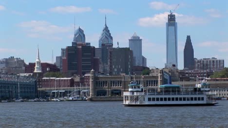 A-ferry-passes-by-Philadelphia-Pennsylvania-at-day-