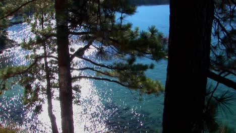 Aqua-colored-water-in-Lake-Tahoe-shimmers-in-the-sunlight-near-the-Sierra-Nevada-mountains