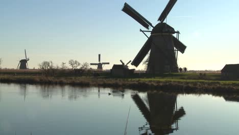 A-tilt-up-to-windmills-along-a-canal-in-Holland