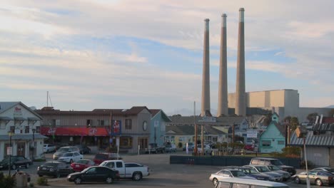 The-town-of-Morro-Bay-in-California-with-industrial-smokestacks-in-background