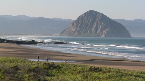 An-establishing-shot-of-a-large-rock-along-the-coast-of-California-near-Morro-Bay