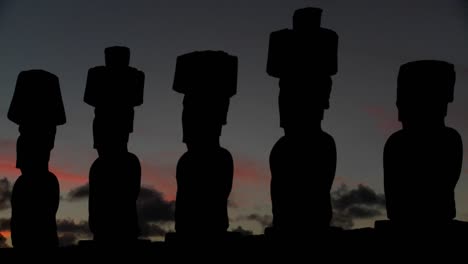 The-sun-sets-behind-Easter-Island-statues