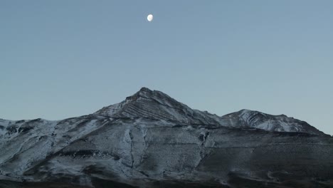 A-full-moon-rises-over-the-Andes-mountains-in-Patagonia