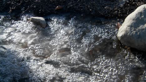 In-the-spring-snow-and-ice-melts-and-rivulets-form-under-the-frozen-glacier-3