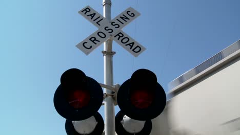 Red-lights-flash-at-a-railroad-crossing