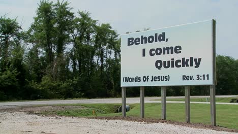 A-large-white-sign-quotes-Jesus-along-a-rural-roadway