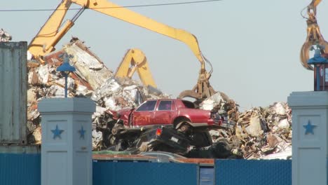 Cranes-lift-and-move-scrap-metal-around-abandoned-and-destroyed-cars-in-a-junkyard-or-scrap-metal-yard-1