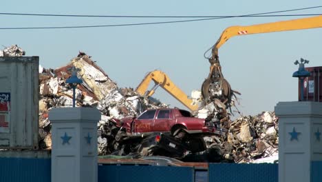Cranes-lift-and-move-scrap-metal-around-abandoned-and-destroyed-cars-in-a-junkyard-or-scrap-metal-yard-2