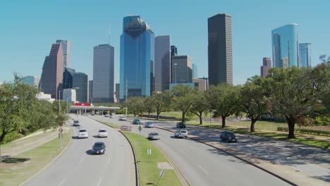 Cars-drive-along-a-highway-leading-into-downtown-Houston-1