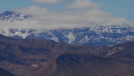 A-slow-move-back-on-a-time-lapse-of-a-beautiful-mountain-range-in-winter-in-Death-Valley