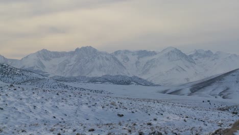 Winter-light-shines-down-on-a-snowy-Sierra-Nevada-landscape-1
